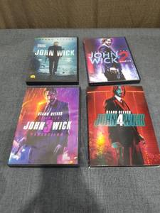 lot 894 image: John Wick 4-Movie Collection DVD Lot Keanu Reeves Chapters 1 2 3 4