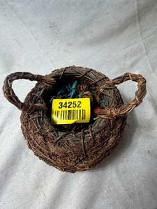 lot 34252 image: Woven Vine Bird Nest filled with small pinecones