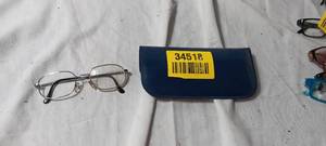 lot 34518 image: Black and silver glasses with Blue case
