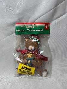 lot 34300 image: vintage metal Christmas tree ornament featuring a teddy bear,
