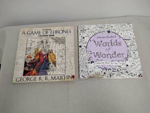 lot 36 image: Lot of 2 Coloring Books A Game of Thrones by George R.R. Martin & Worlds of Wonder by Johanna Basford