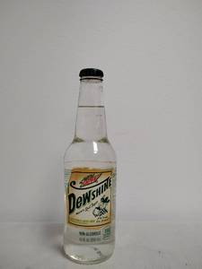 lot 88 image: Vintage collectible Mountain Dew Dewshine Clear Citrus Flavored 12 FL OZ glass bottle, never opened