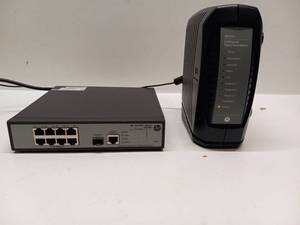 lot 14 image: HP 1910-8G Switch JG348A and Motorola SURFboard SBV5322 Digital Voice Modem