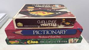 lot 45 image: Challenge Yahtzee, Pictionary, Clue Classic Edition Board Games Lot