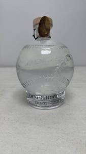 lot 90 image: Sealed Baseball-Shaped Bottle
