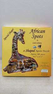 lot 122 image: African Spots Shaped Jigsaw Puzzle by Lori Schory 700 pieces 26.5x37.5 Item 95349