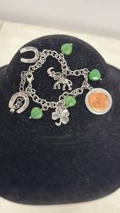 lot 159 image: Charm Bracelet with Green Beads, Horseshoe, Elephant and Four Leaf Clover Charms