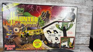 lot 100 image: Haunted Highway Electric Slot Car Racing Set