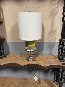 lot 35193 image: Silver base table lamp with cream lamp shade