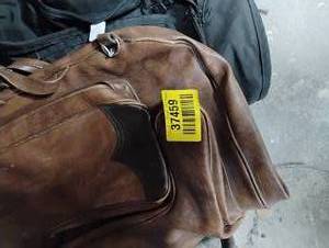 lot 37459 image: COMPLETE OUTFIT STORAGE BAG.