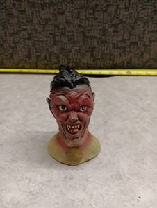 lot 1500 image: Devil Head Figurine Ornament with Black Hair and String Attachment