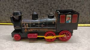 lot 1550 image: Tin Plate Train Engine with Passenger Car and Yellow Coupling Approximately 14 inches