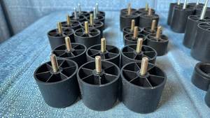 lot 2001 image: Lot of 36 Assorted Black Plastic Round Furniture Legs. Includes Various Widths and Heights.