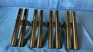 lot 2006 image: Lot of Brass Furniture Legs.