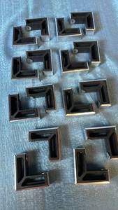 lot 2008 image: Lot of 16 Chrome L-Shaped Furniture Feet.