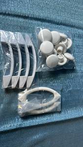 lot 2011 image: Assortment of White Drawer or Door Handles.