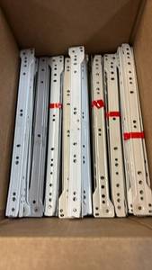 lot 2063 image: Lot of 35 White and Off white 14 Drawer Glide Sets.