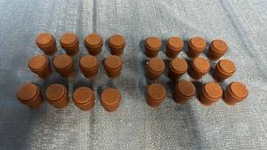 lot 2071 image: Lot of 24 Brown 1 Chair Leg Caps.