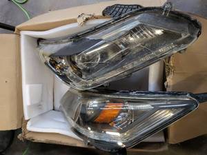 lot 4104 image: Lot of 2 Mystery Headlights for Unknown Vehicle - One Broken