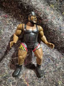 lot 3 image: Wrestling Action Figure with Black Tank Top Red Yellow Shorts