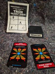 lot 113 image: Intellivision Tron Deadly Discs Cartridge with Instructions and Overlays