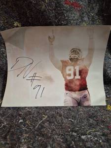 lot 127 image: Autographed Football Player Photo #91 - Not Authenticated