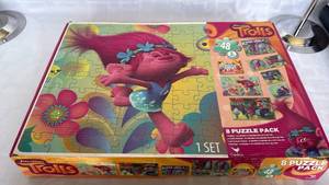 lot 858 image: DreamWorks Trolls 8 Puzzle Pack Set