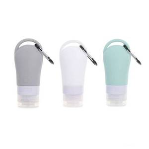 lot 1408 image: MISSING WHITE HomeSoGood 2Pcs Leakproof Silicone Refillable Squeezable Travel Tube with Keychain Hook for Cosmetic Toiletry Shampoo Sub-bottling Travel Bottle(60ml) - Retail $9