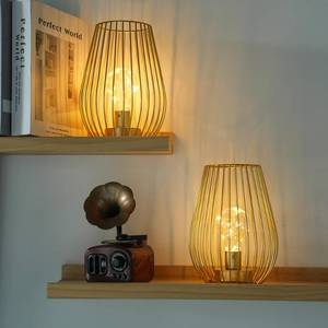 lot 1428 image: TRIROCKS Metal Cordless Table Lamp - 8 Tall Set of 2 Cage Shape Battery Operated Lamp with Fairy Lights Bulb for IndoorOutdoor Use Perfect for Christmas Garden and Weddings (Gold,Set of 2) - Retail $38