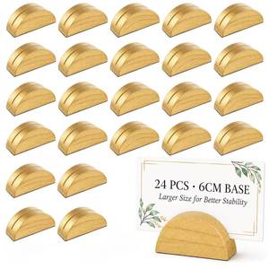 lot 1767 image: 24 Pcs 6cm Large Table Number Holders Stands, Gold Wooden Semicircular Base Place Card Holders for Table  for Wedding, Restaurant Menu, Photo, Office Tag Clips, Party Events Decoration (Gold-24) - Retail $16