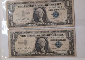 lot 410 image: Two United States One Dollar Bills Blue Seal Silver Certificates -1957&nbsp