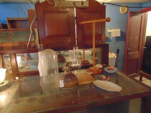 lot 3934 image: Necklace Holder and Contents on top of display case
