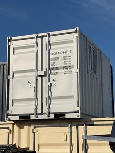 lot 10361 image: Unused 11ft Container Cabin with Side Door and Window (IRC11)