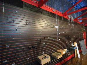 lot 14857 image: Collection of Wire Shelving, Shelving Parts, and Slat Wall