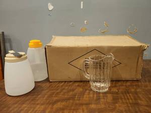 lot 12752 image: Plastic Pitcher Set w 12 Pitchers &amp 2 Dressing Dispensers