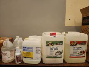 lot 12842 image: Lot of Assorted Cleaning Supplies  Zep Floor Stripper, Floor Polish, Sanitizers &amp Cleaning Chemicals