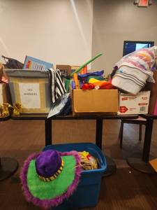 lot 18714 image: Lot of Costume Hats, Drawstring Bags, Tracer Projector, Boomwhacker-Style Tubes & Party Items