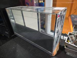 lot 12873 image: Glass Display Showcase Counter with Chrome Trim and Back Panels