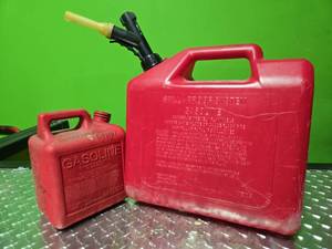 lot 14894 image: (2) 1 - 5 Gallon Gas Cans and 1 - Gallon Mixed Fuel Can