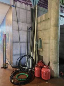 lot 14910 image: (3) Red Portable Gas Tanks, Black Cable Coils, Green Wire &amp Assorted Pipe
