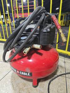 lot 14928 image: Porter-Cable 6 Gallon 150 PSI Pancake Air Compressor w Hose  Model C2002