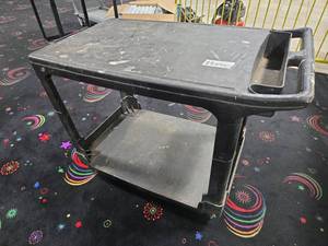 lot 22040 image: Black Two-Shelf Molded Plastic Utility Cart w Handle & Storage Tray on Casters