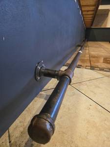 lot 22078 image: Black Iron Pipe Wall-Mounted Rail with Floor Flange Brackets and Tee Fittings