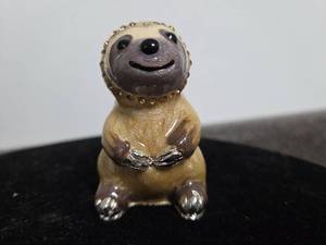 lot 54 image: Decorative Figurine Slothl with Studded Collar and Articulated Tail