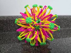 lot 93 image: 3D Buildable Fidget Sphere Construction Toy Yellow Pink Green