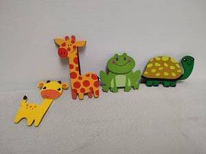 lot 27 image: Lot of four wooden animal pieces.