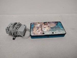 lot 28 image: Nintendo 3DS Handheld Gaming Console Teal with Charger