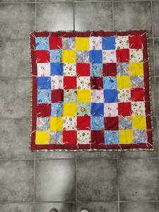 lot 103 image: Handmade Patchwork Quilt with Printed Fabric Squares and Binding