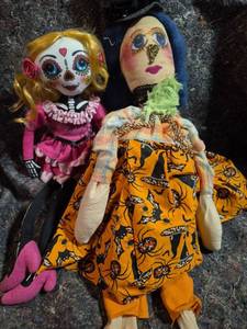 lot 14 image: 2 Handmade Fabric Dolls with Painted Faces and Yarn Hair