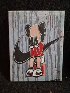 lot 77 image: Canvas Painting Cartoon Character with Nike Swoosh 9 x 12